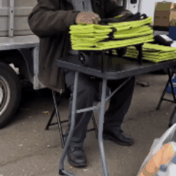 CarryLess rolling foldable tote carrying a full load of bags on its wheels